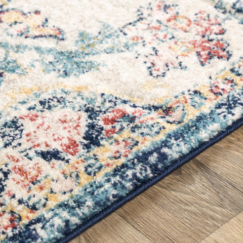 Livabliss rug with a spilled liquid being blotted to show stain resistance and easy cleaning