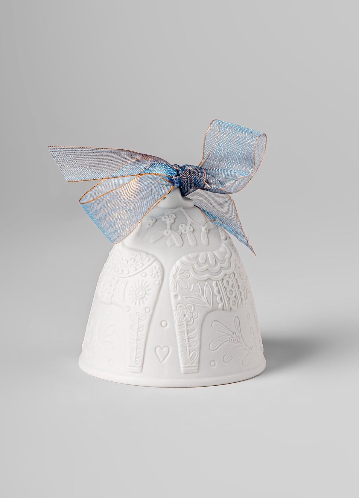 LLADRÓ close-up of the bell’s matte porcelain texture highlighting handcrafted quality