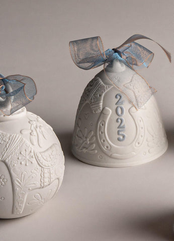 LLADRÓ bell on a mantel illustrating elegant holiday styling and visual impact