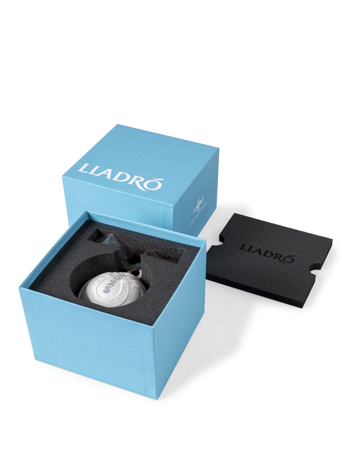 LLADRÓ ornament on a stand in a living room setting adding sophisticated holiday style