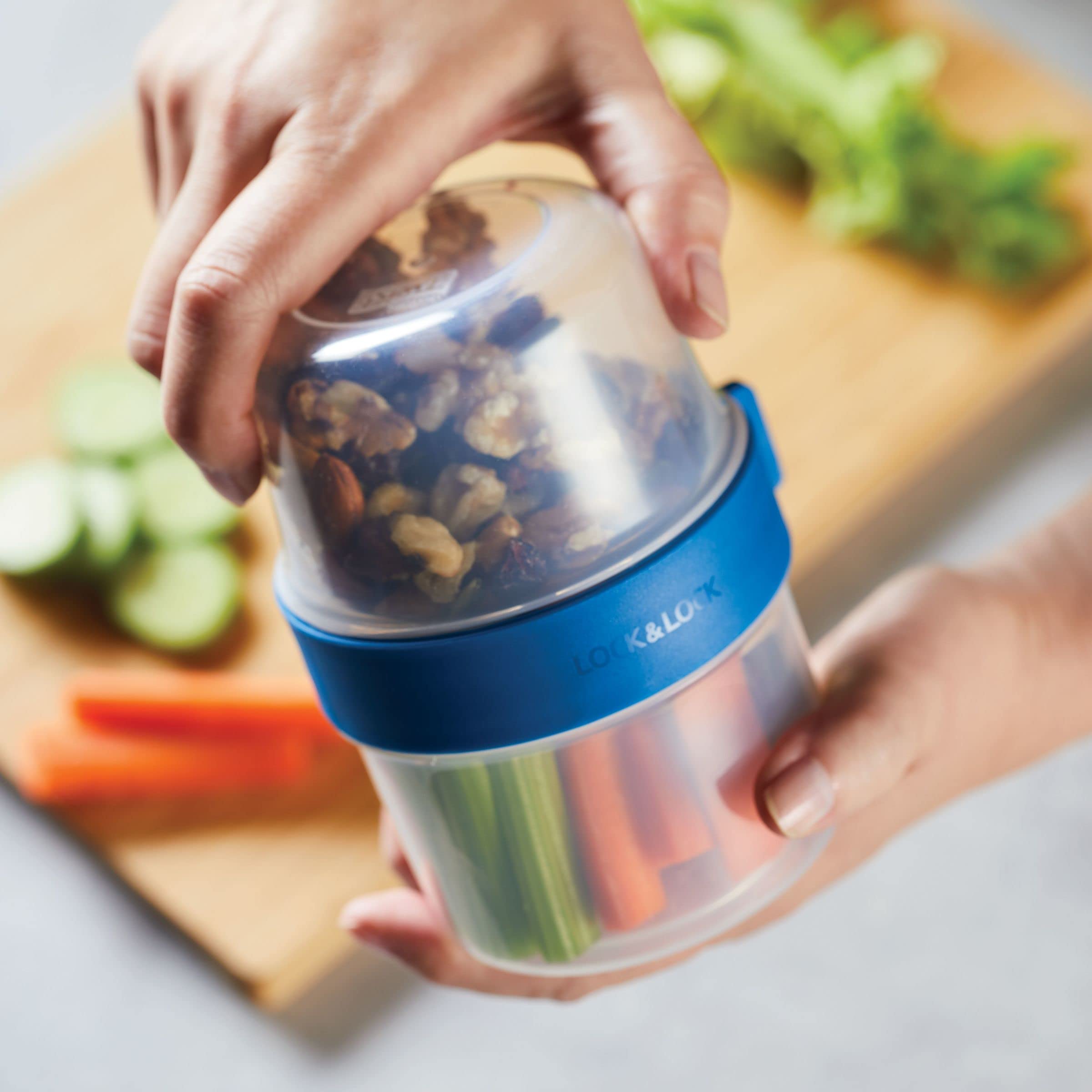 LocknLock pouring soup from sealed container showing leakproof confidence