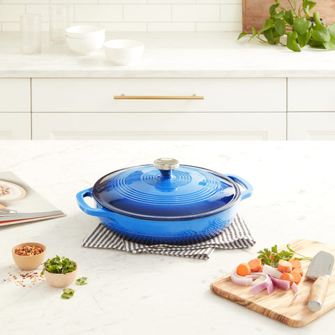 Lodge lid close-up highlighting moisture-locking rim and sturdy handle for better steam retention