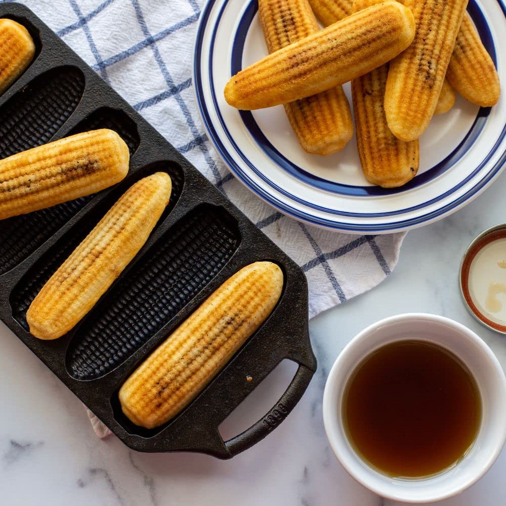 Lodge cornstick pan dual-handle closeup highlighting safe grip and easier lifting