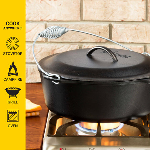 Lodge dutch oven bail handle detail showing secure grip for lifting over coals