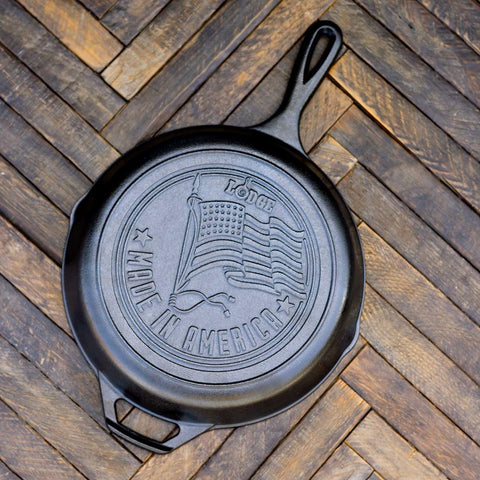 Lodge skillet in kitchen being used to sear meat showcasing brand versatility and heat retention