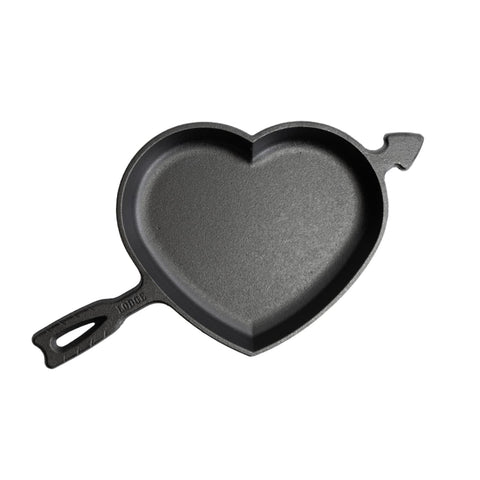 Lodge heart skillet front view showing collectible heart-and-arrow design and cast-iron durability