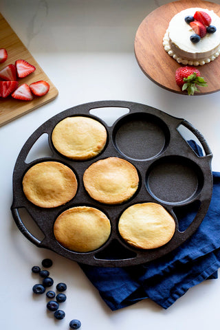Lodge pan filled with golden biscuits demonstrating even browning and portion control benefit