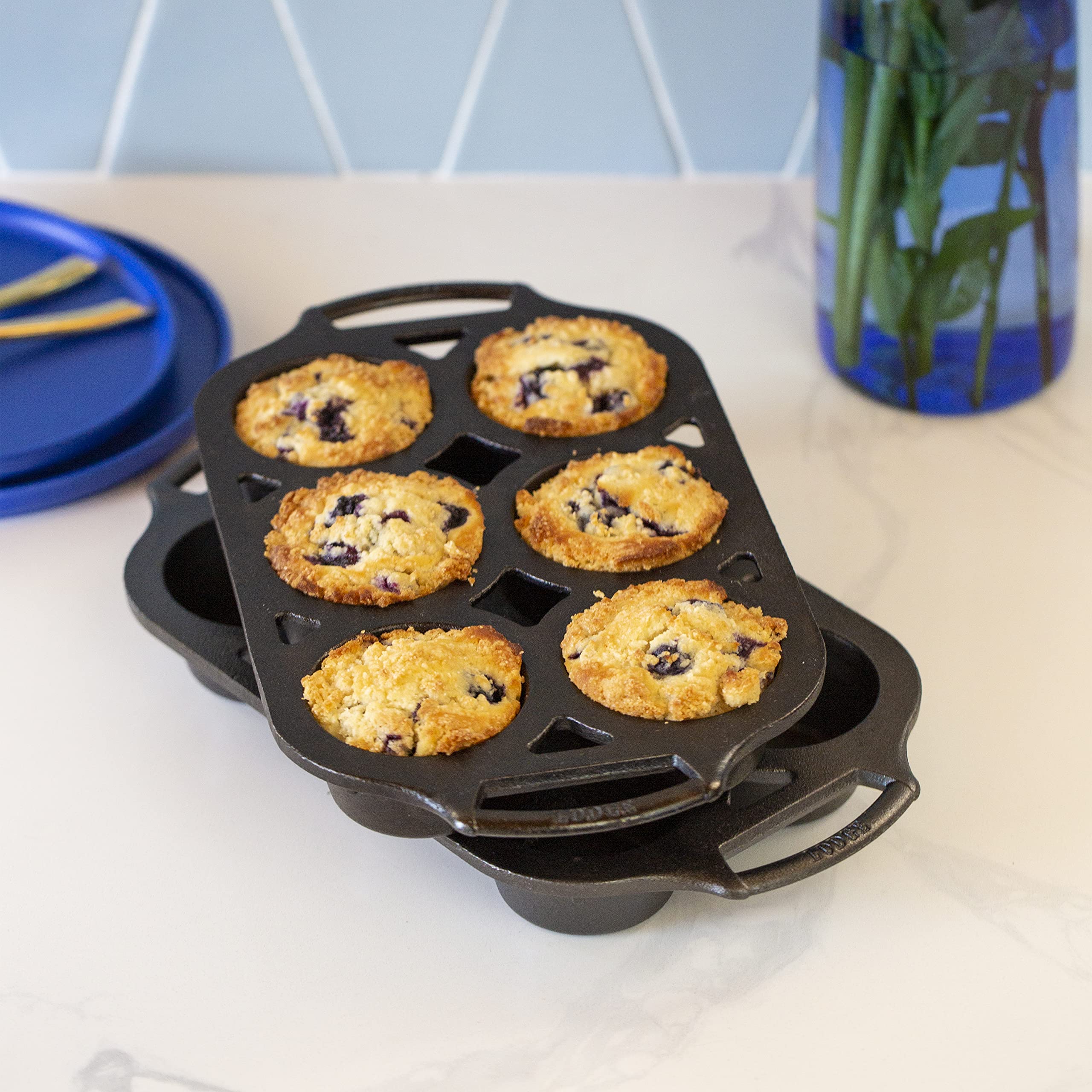 Lodge muffin pan dual handles detail showing grip benefit for safe oven transfer