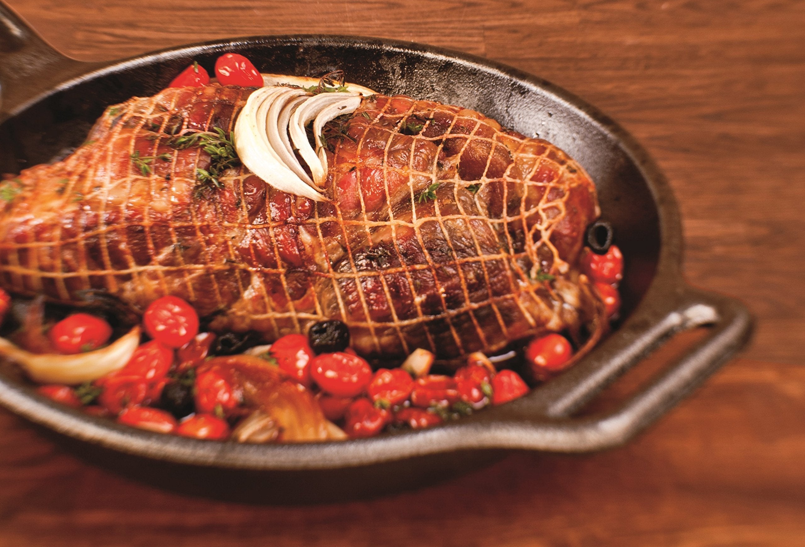 Lodge skillet in use with seared steak illustrating even heat and crust development