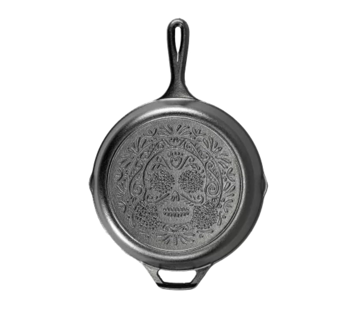 Lodge skillet front view showing sugar skull artwork and cooking-ready finish
