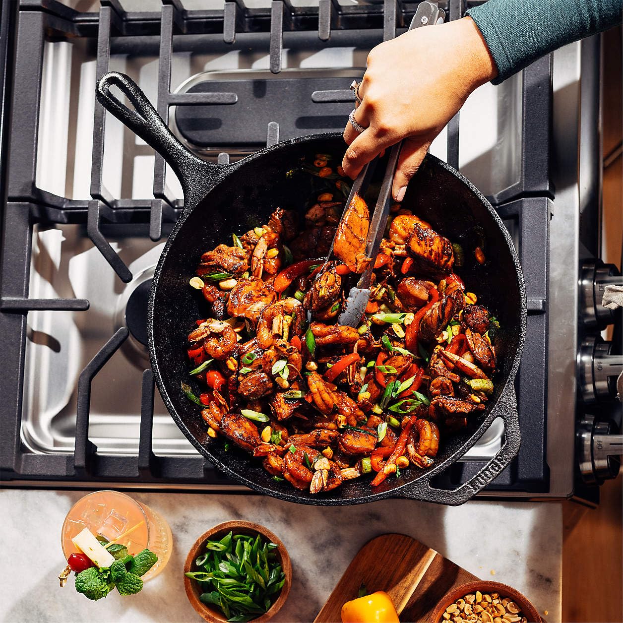 Lodge wok size comparison beside hand for scale and versatile kitchen fit