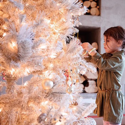 LOENDE lights held in a hand to show scale and portability for easy placement