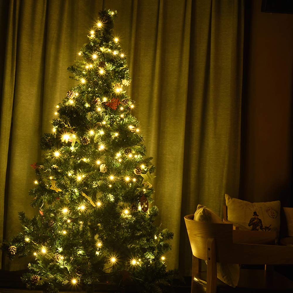LOENDE string lights wrapped around a Christmas tree, warm glow creates cozy ambience