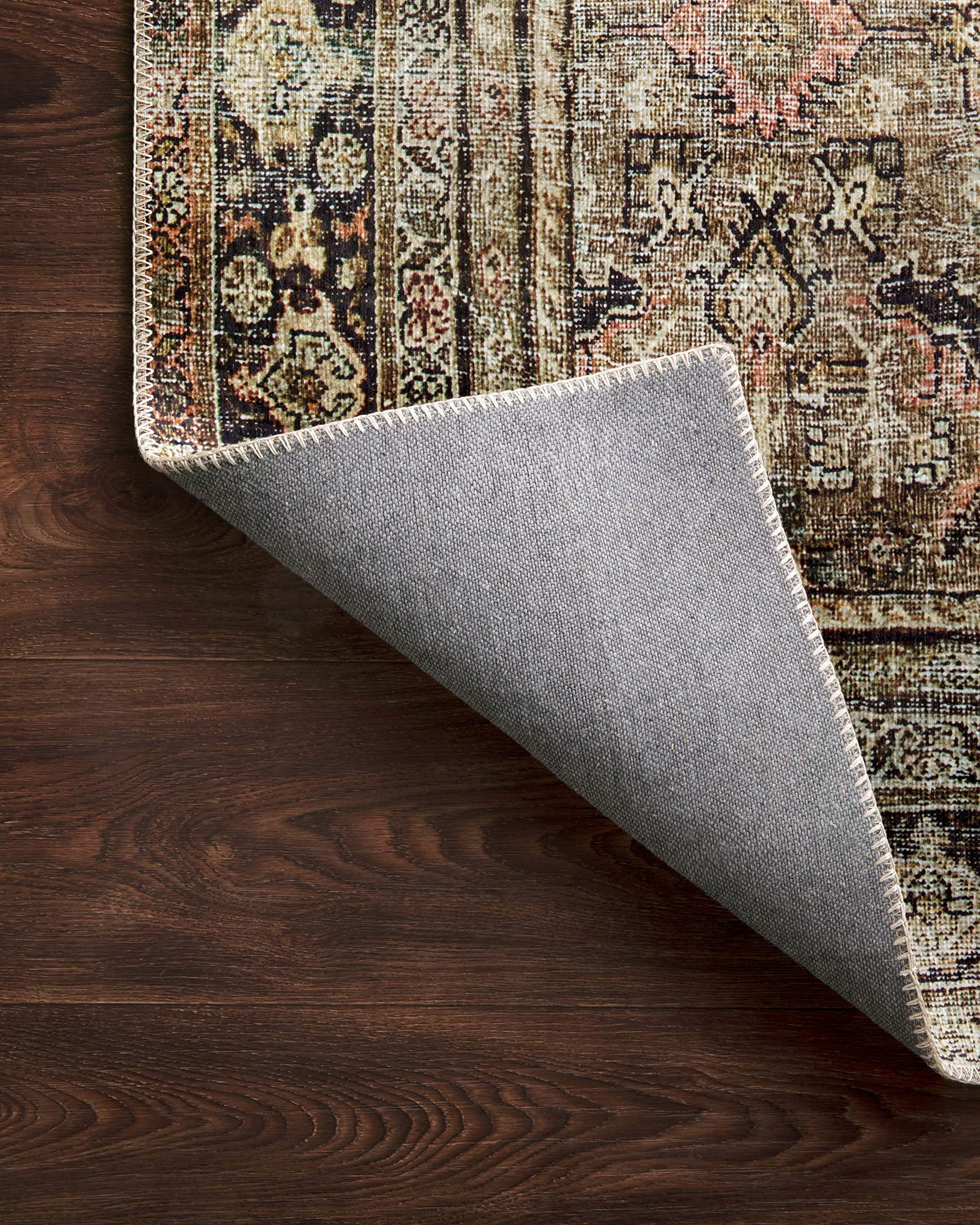 Loloi Layla layered over wood floor showing styling versatility benefit