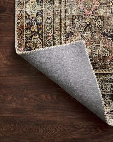 Loloi Layla layered over wood floor showing styling versatility benefit