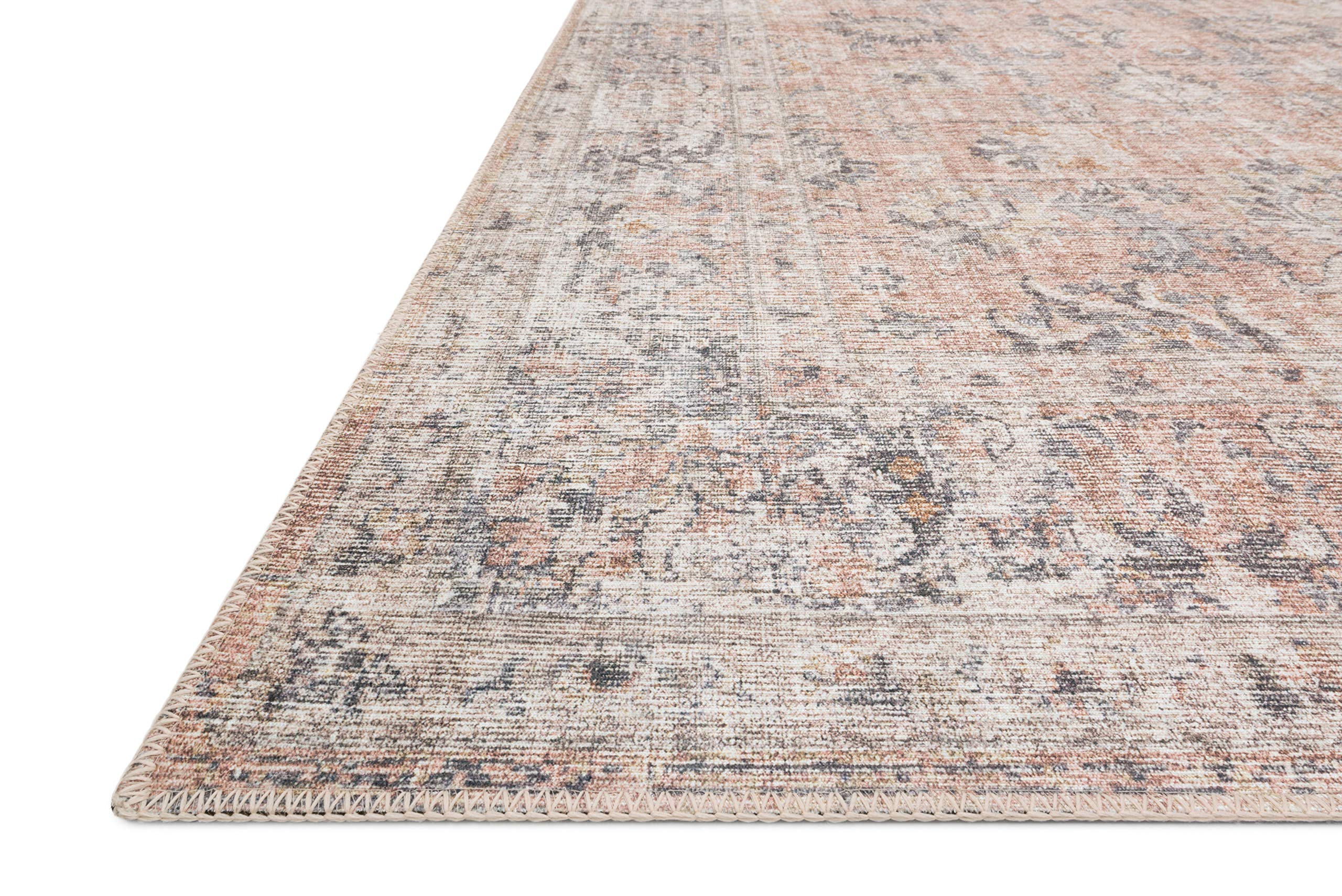 Loloi Skye corner detail highlighting distressed motif and stitched edge