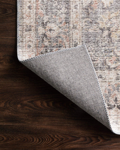 Loloi Skye rolled packaging with sample tile showing ordering and color check