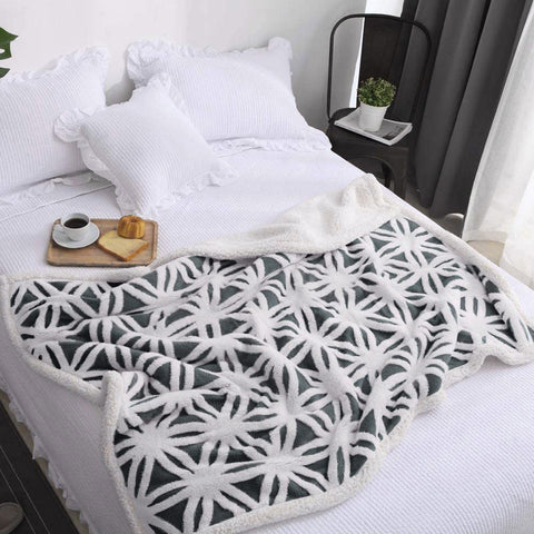 LOMAO blanket in cozy living room scene providing ambient warmth and decorative texture