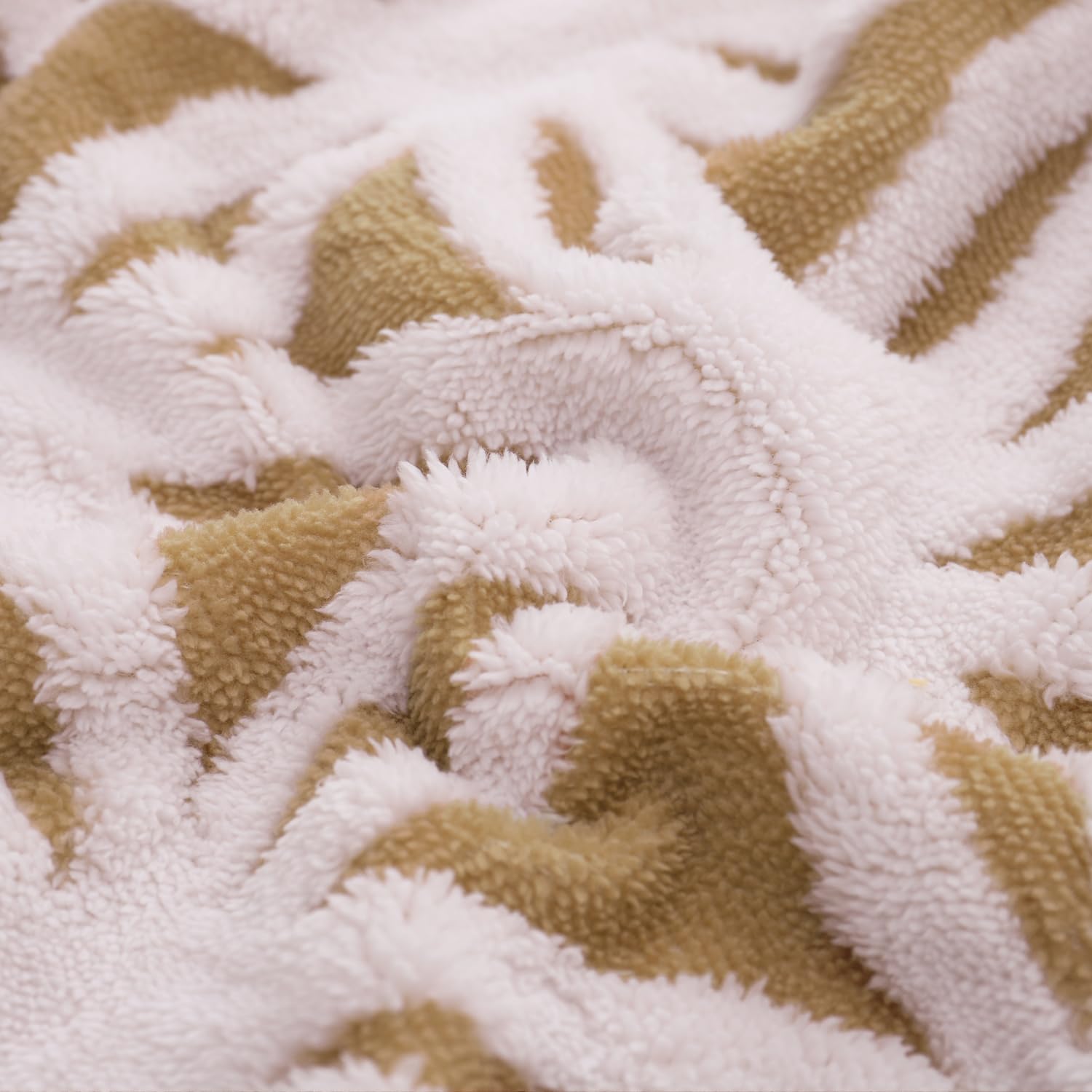 LOMAO blanket next to book illustrating 51x63 size and easy portability