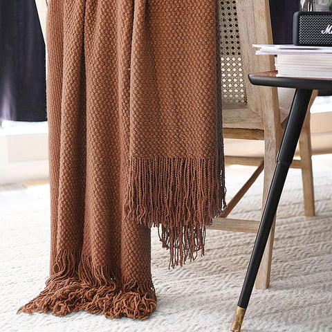 LOMAO throw draped on sofa offering layered comfort and visual warmth
