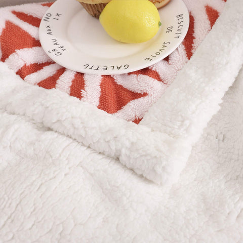 LOMAO folded blanket in basket showing compact storage and neatness benefit