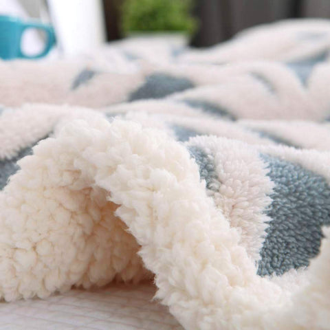 LOMAO blanket draped over a sofa during movie night adding couch comfort
