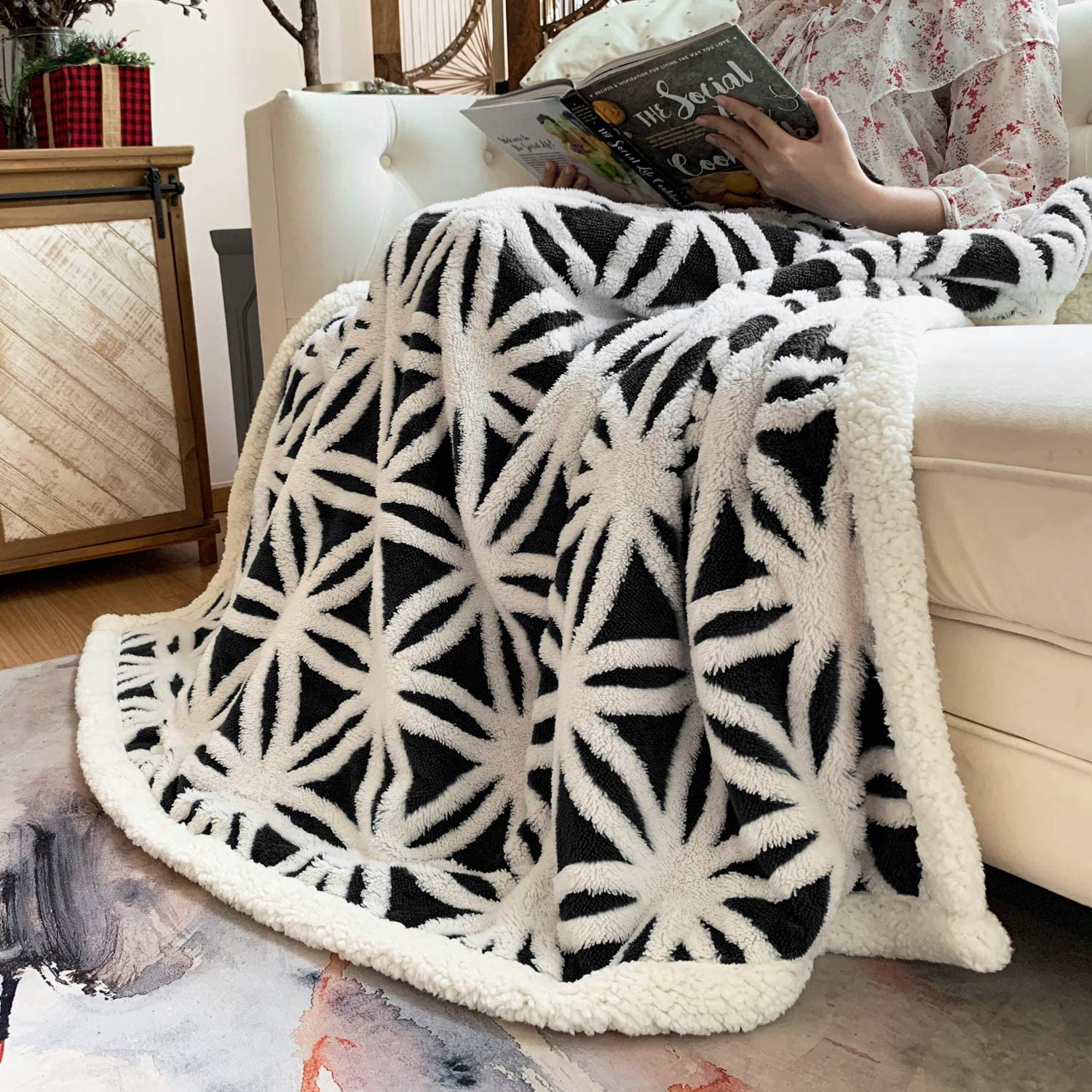 LOMAO blanket beside chair showing size comparison and easy portability
