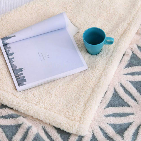 LOMAO blanket on bed illustrating 51x63 inch size for shared warmth