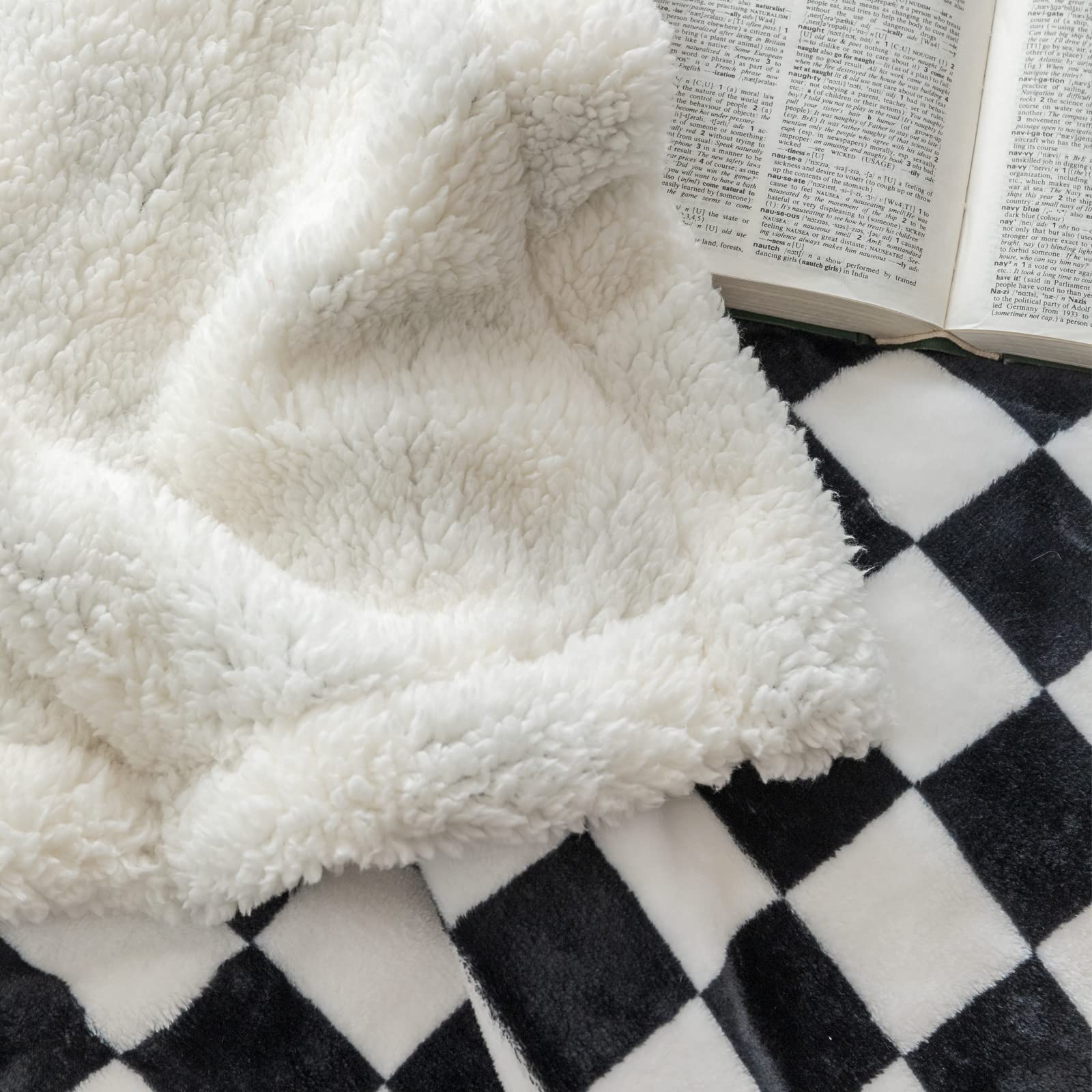 LOMAO folded throw displayed on shelf for neat storage and portability