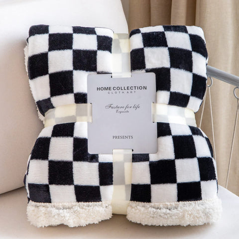 LOMAO throw styled on bed in lifestyle shot suggesting room upgrade