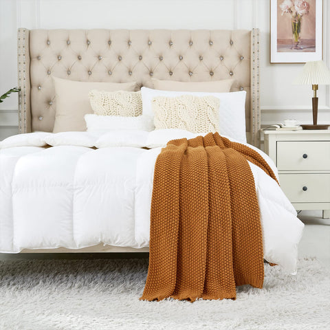 Longhui bedding styled on bed providing decorative cozy accent