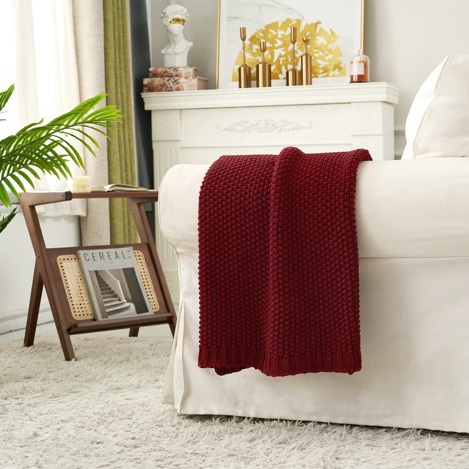 Longhui bedding throw styled on sofa adding warmth and color to living room seating area