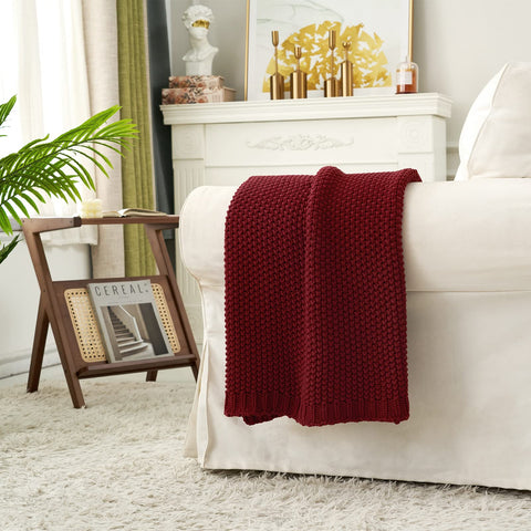 Longhui bedding throw styled on sofa adding warmth and color to living room seating area