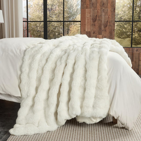 Lotus Karen draped over sofa adding decorative texture and living room warmth