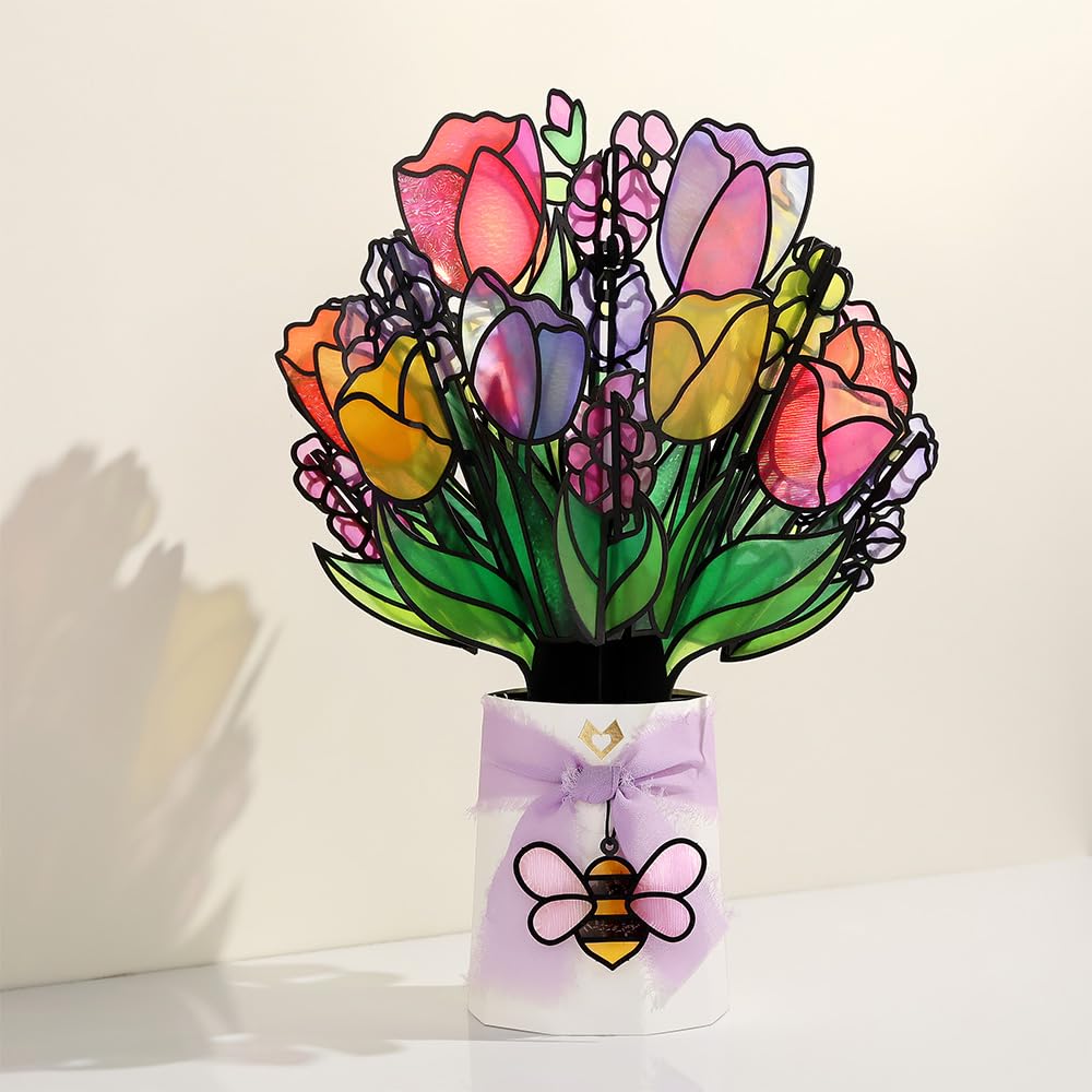 Lovepop placed in a sunny windowsill casting colorful reflections