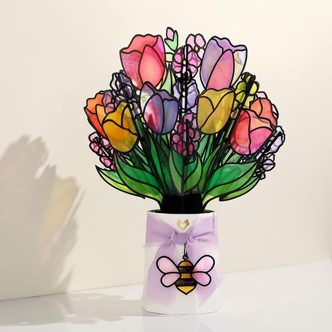Lovepop placed in a sunny windowsill casting colorful reflections
