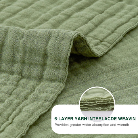 Love's cabin person wrapped in sage blanket for lightweight warmth and comfort