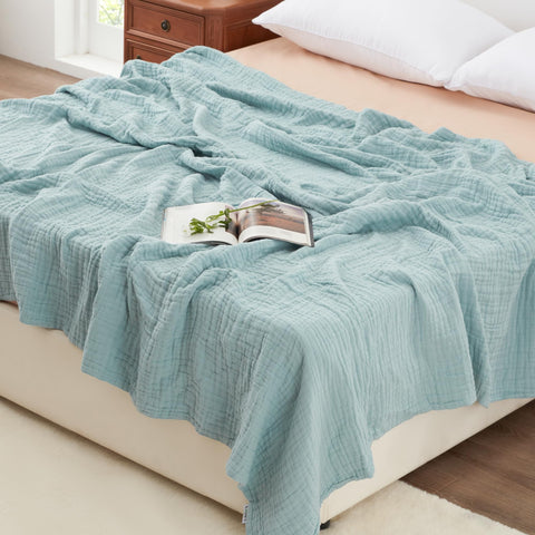 Love's cabin front view of cyan blanket showing full size and neat edges, adds cozy appeal