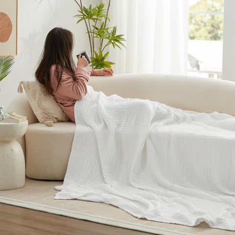 Love's cabin blanket spread on a king bed offering cozy layered bedroom styling
