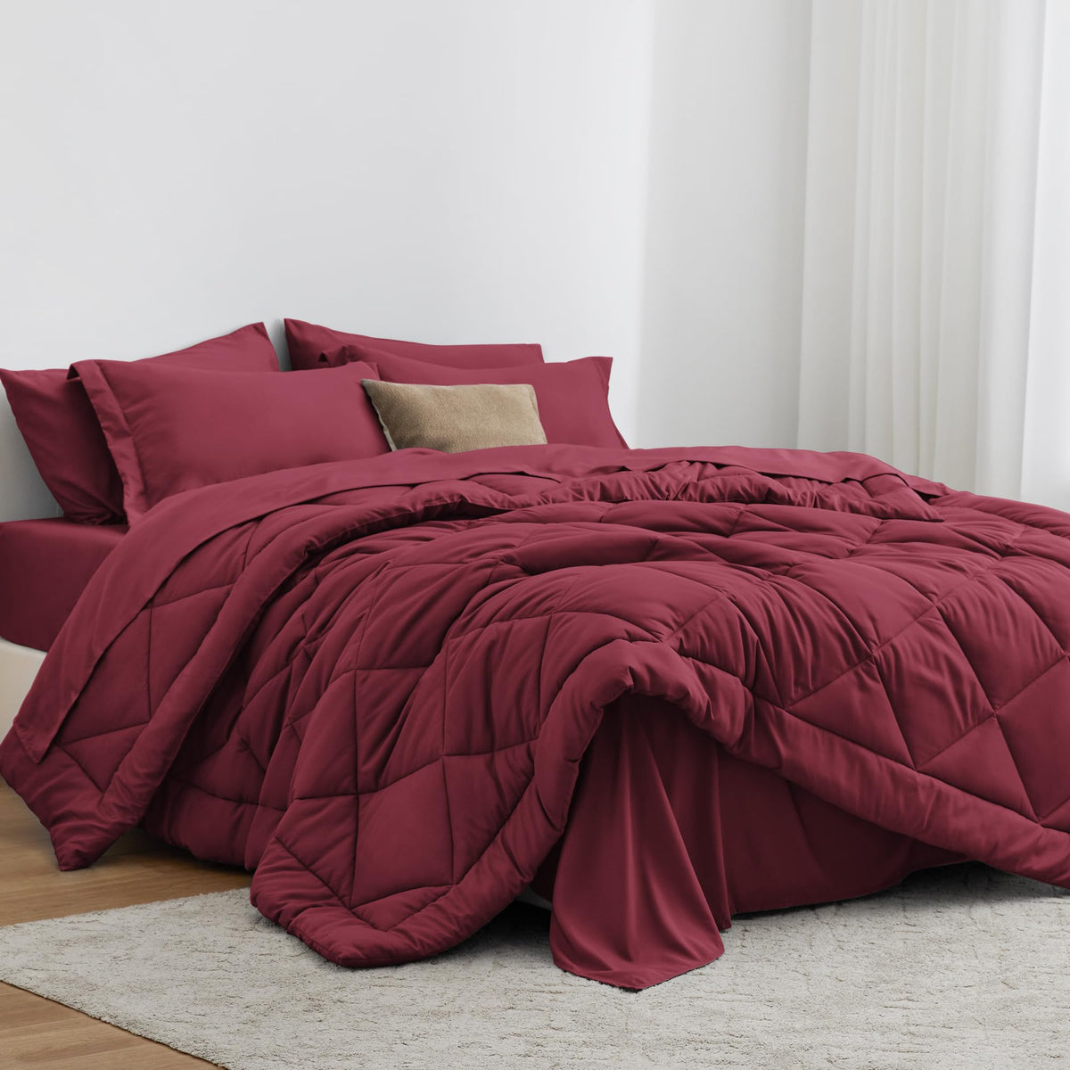 Love's cabin front view of burgundy comforter showing full king coverage benefit