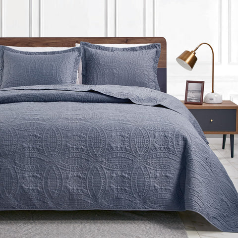 Love's cabin front view of full California King quilt showing modern blue styling