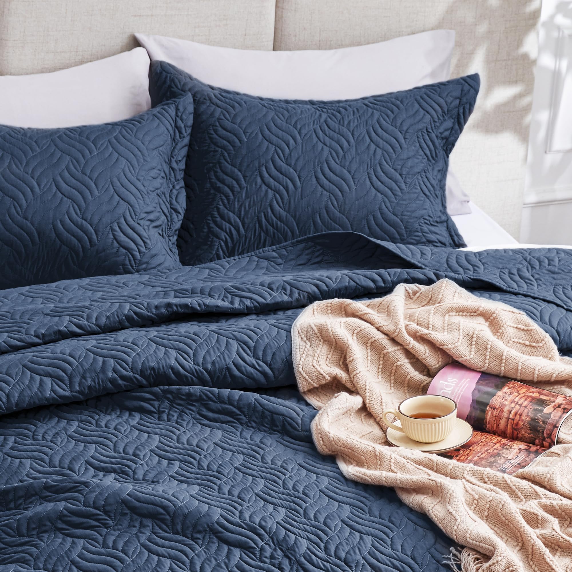 Love's cabin folded quilt set stacked, indicates neat storage and travel-ready convenience