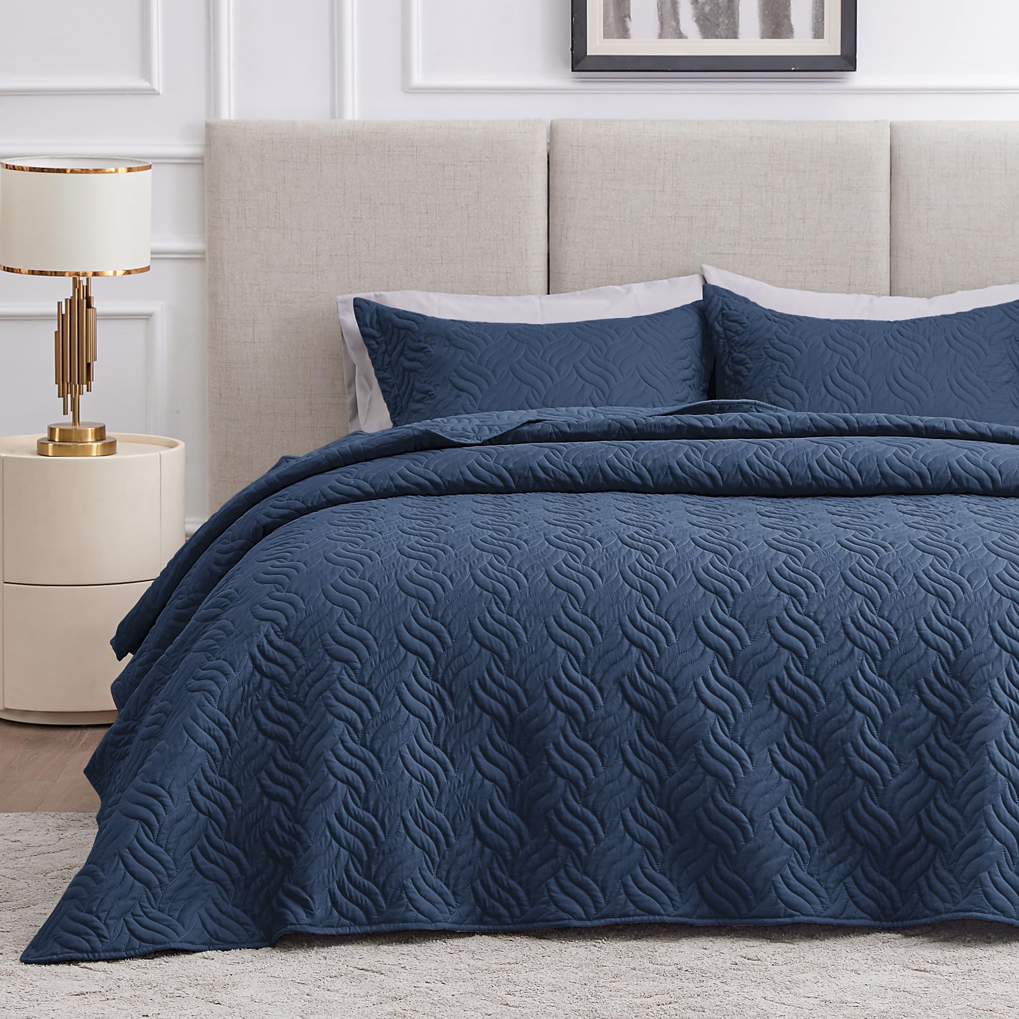 Love's cabin quilt front view showing navy color and wave pattern, stylish bedroom upgrade