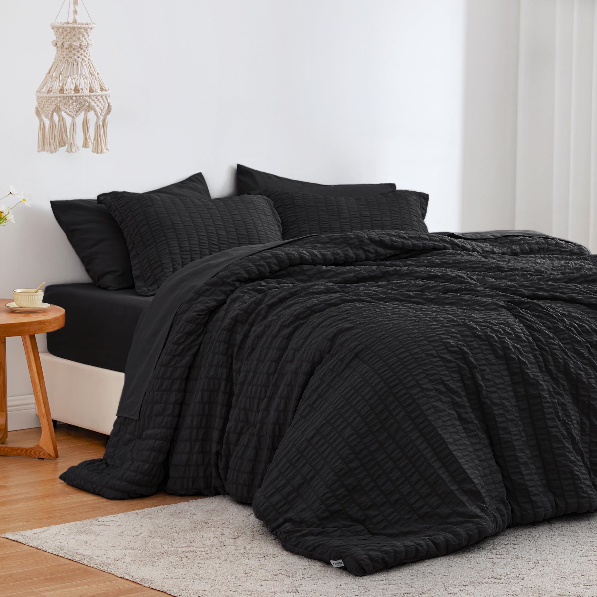 Love's cabin comforter front view showing black seersucker and neat styling benefit: elegant look