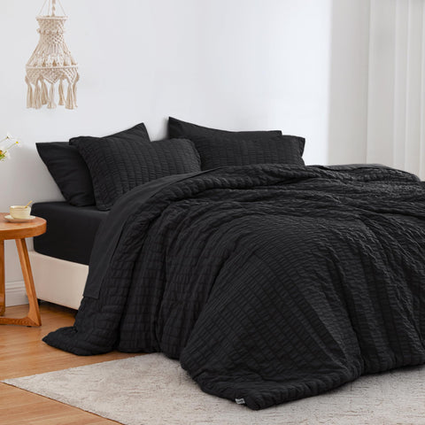 Love's cabin comforter front view showing black seersucker and neat styling benefit: elegant look