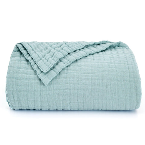 Love's cabin blanket beside pillows for scale, shows generous 90x90 inch coverage