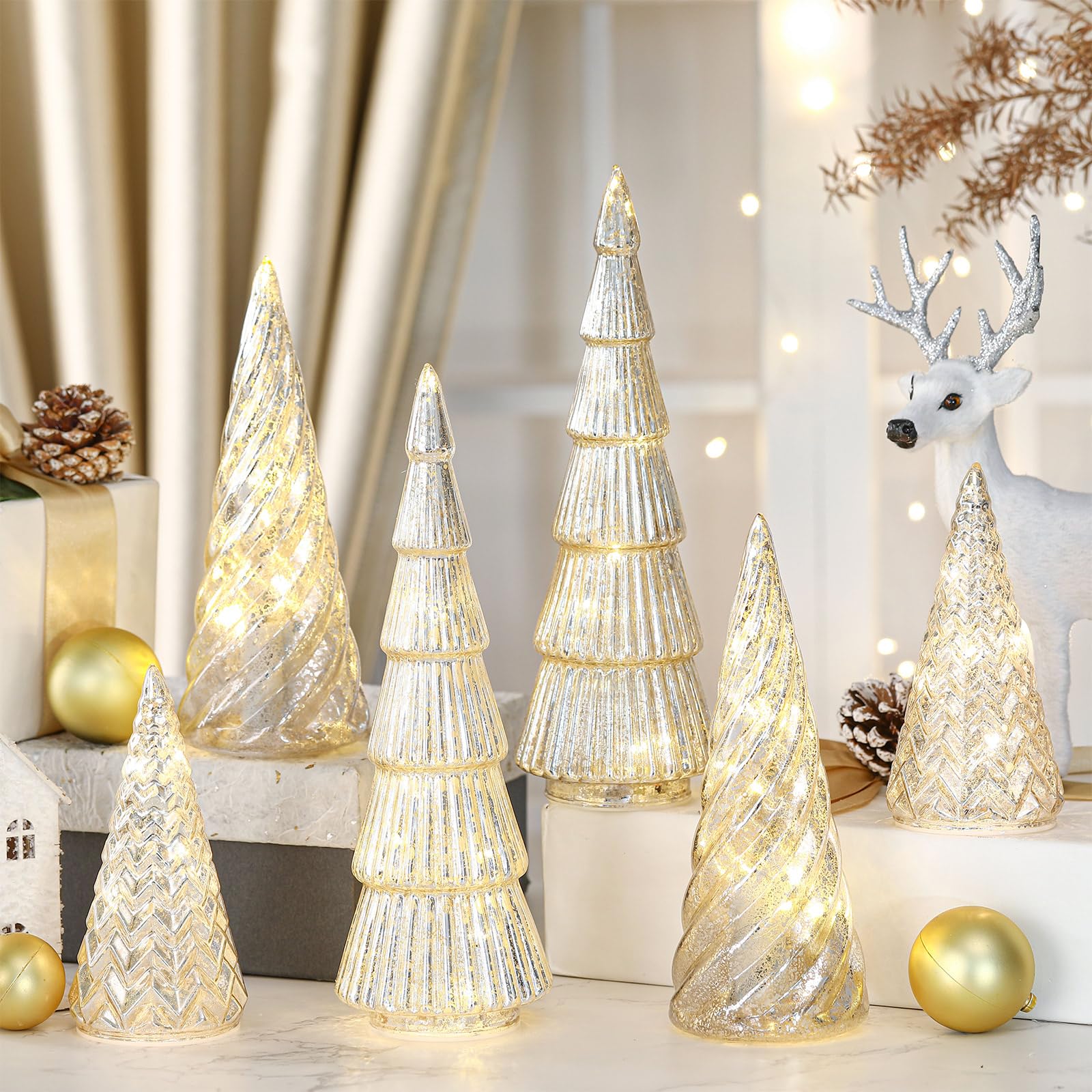 LOYIM front view of six silver trees showing cohesive holiday display and sparkle