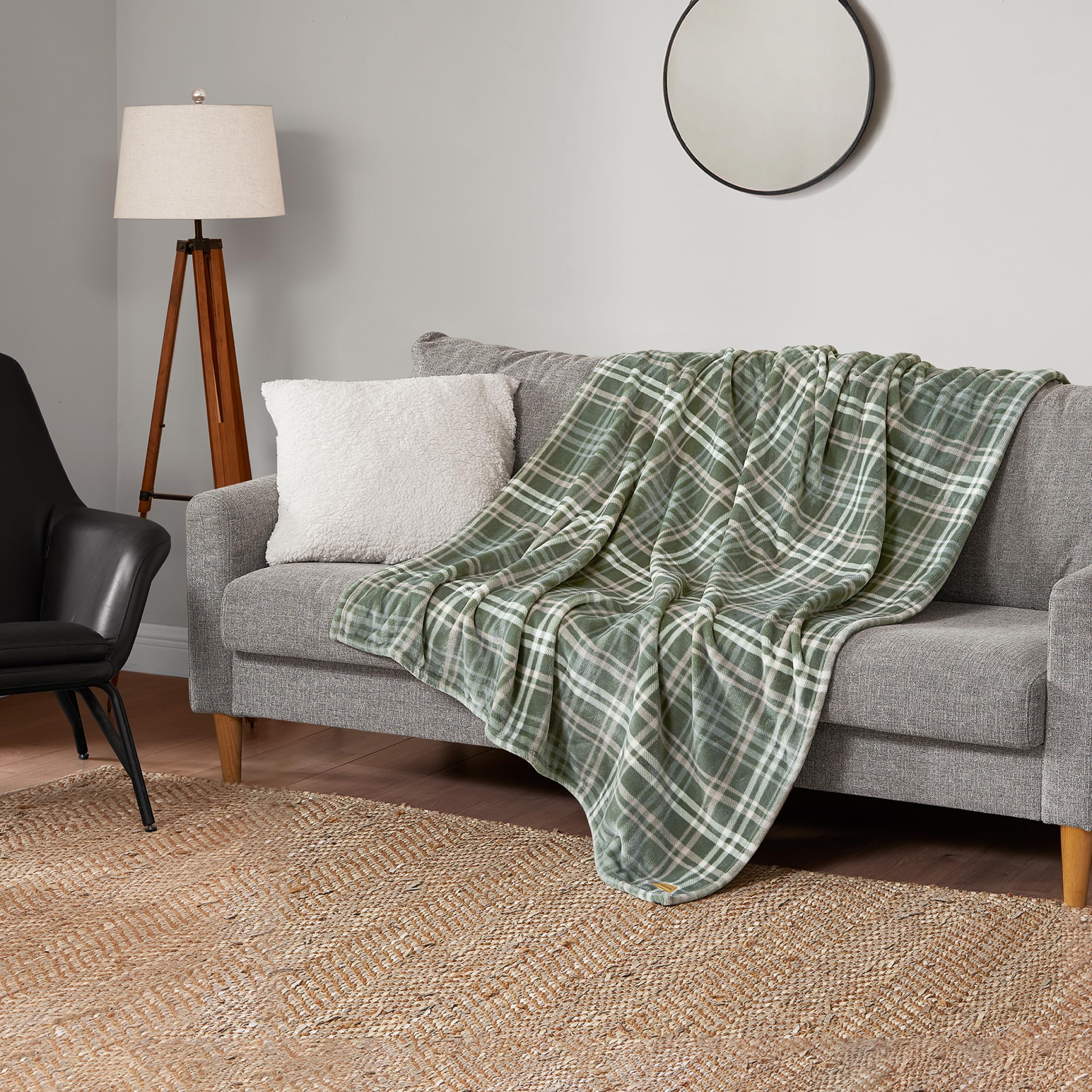 Lucky Brand blanket layered at bed footboard offering decorative warmth and finish