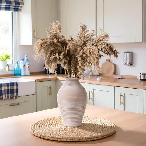 LUKA vase beside a book showing scale and perfect tabletop proportion benefit