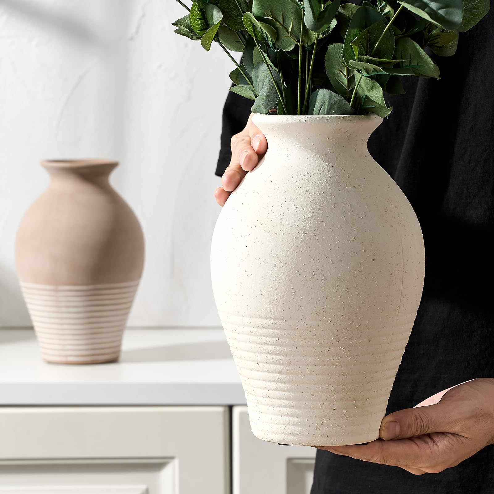 LUKA styled living room with vase adding farmhouse character and balance